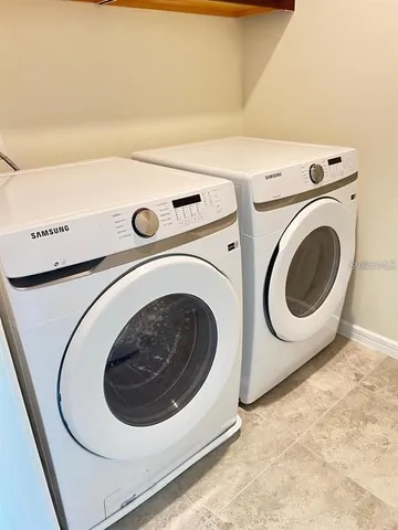 a utility room with dryer and washer