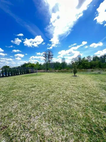 a view of a lake with a yard