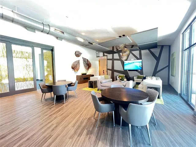 a view of a dining room with furniture window and wooden floor