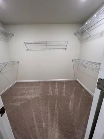 a view of a room with racks on the wall