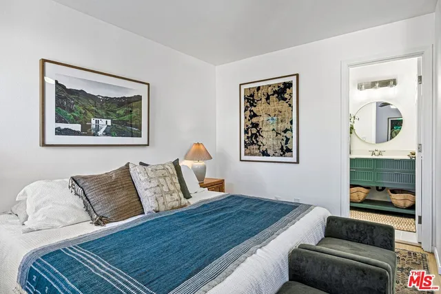 a bedroom with furniture and window