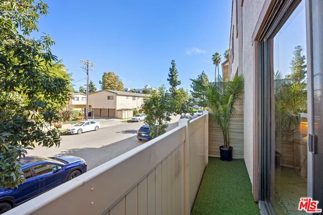 a view of a street from a balcony