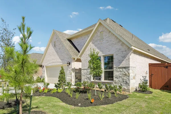 a view of a house with backyard porch and sitting area