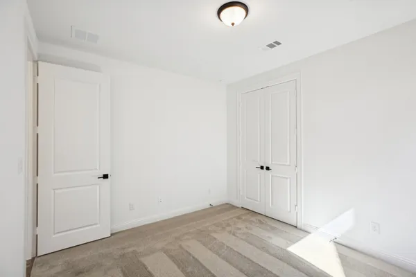 an empty room with wooden floor