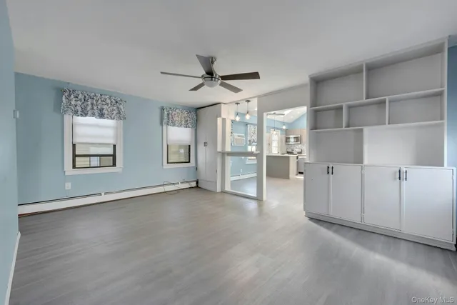 wooden floor in an empty room with a fireplace