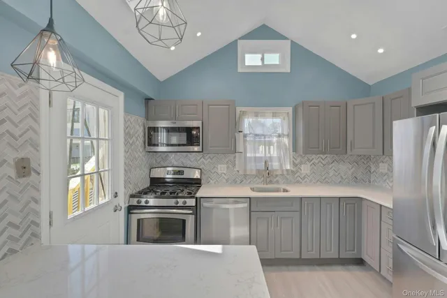 an empty room with window and couch