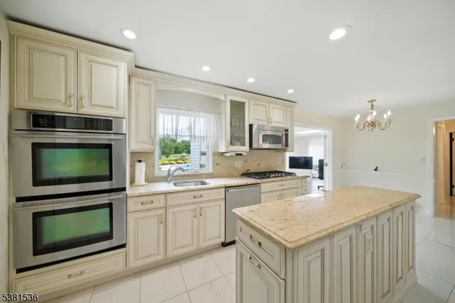 a kitchen with a stove sink and microwave
