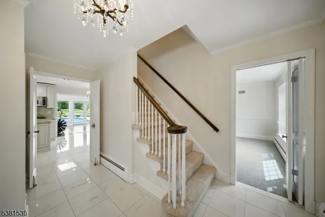 a view of entryway and hall with a living room