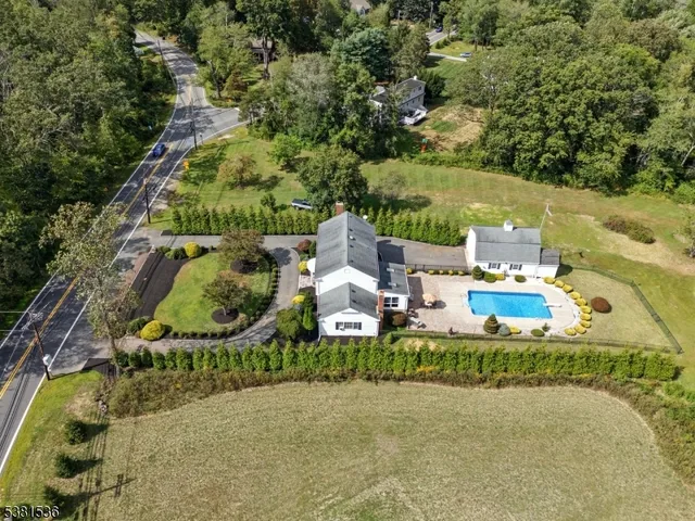 an aerial view of a house with outdoor space