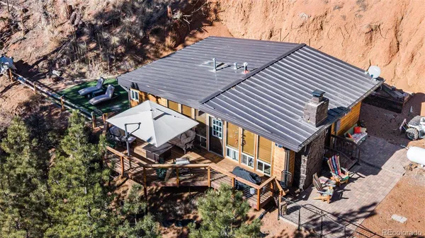 a aerial view of a house with a tree