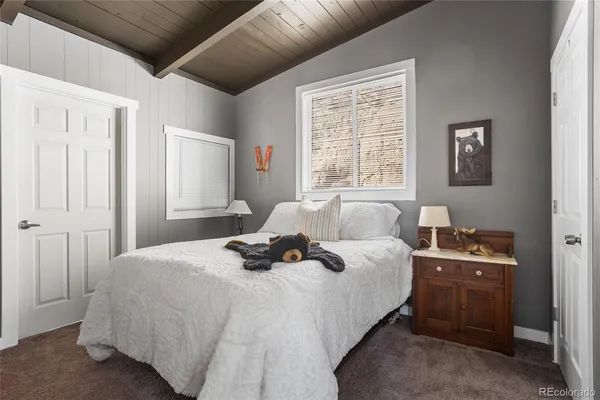 a bedroom with bed and window