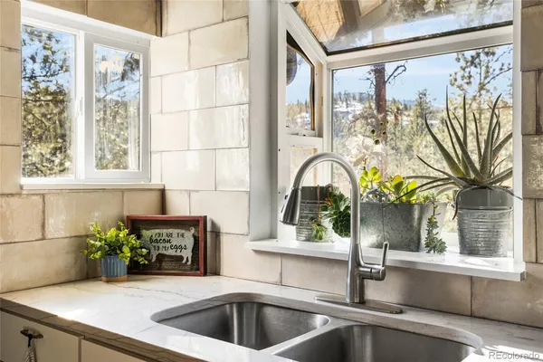 a kitchen with a sink and a window