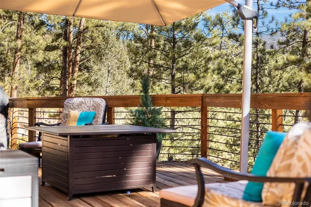 a view of a balcony with outdoor seating