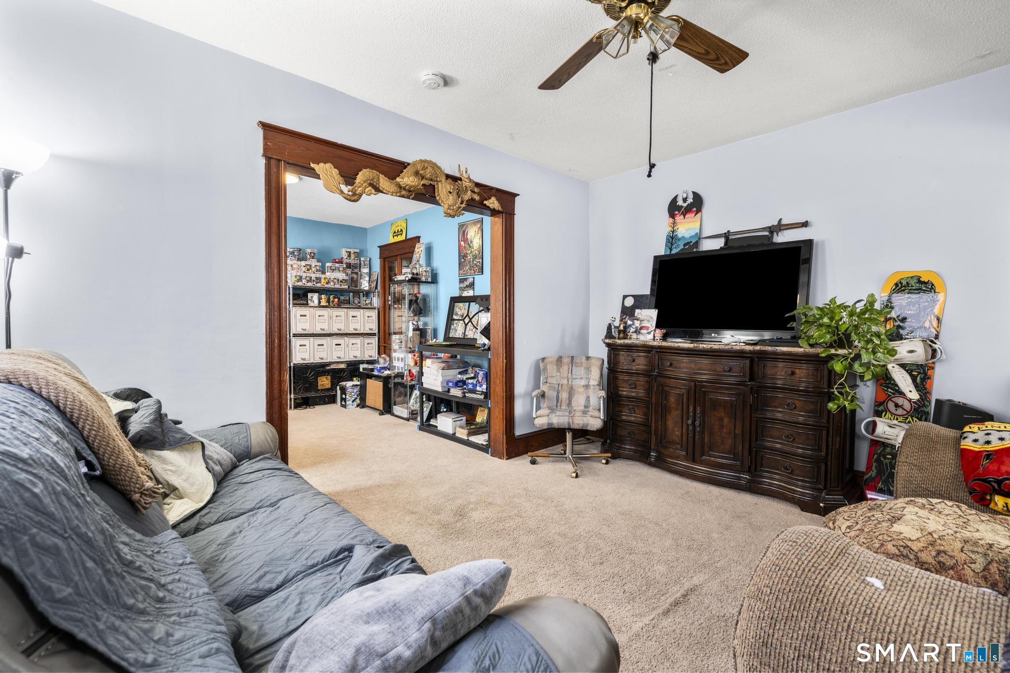 33 Kenney Street Bristol, CT 06010 - Photo 11 of 40 a bed room with a bed and a television