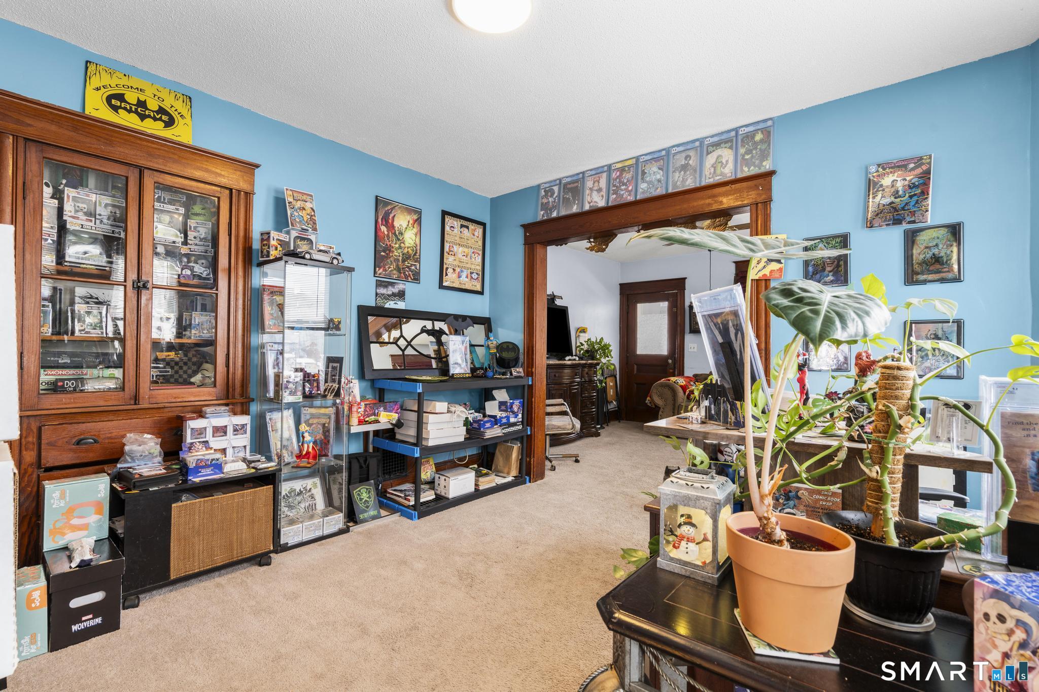 33 Kenney Street Bristol, CT 06010 - Photo 12 of 40 a room with furniture and a flat screen tv