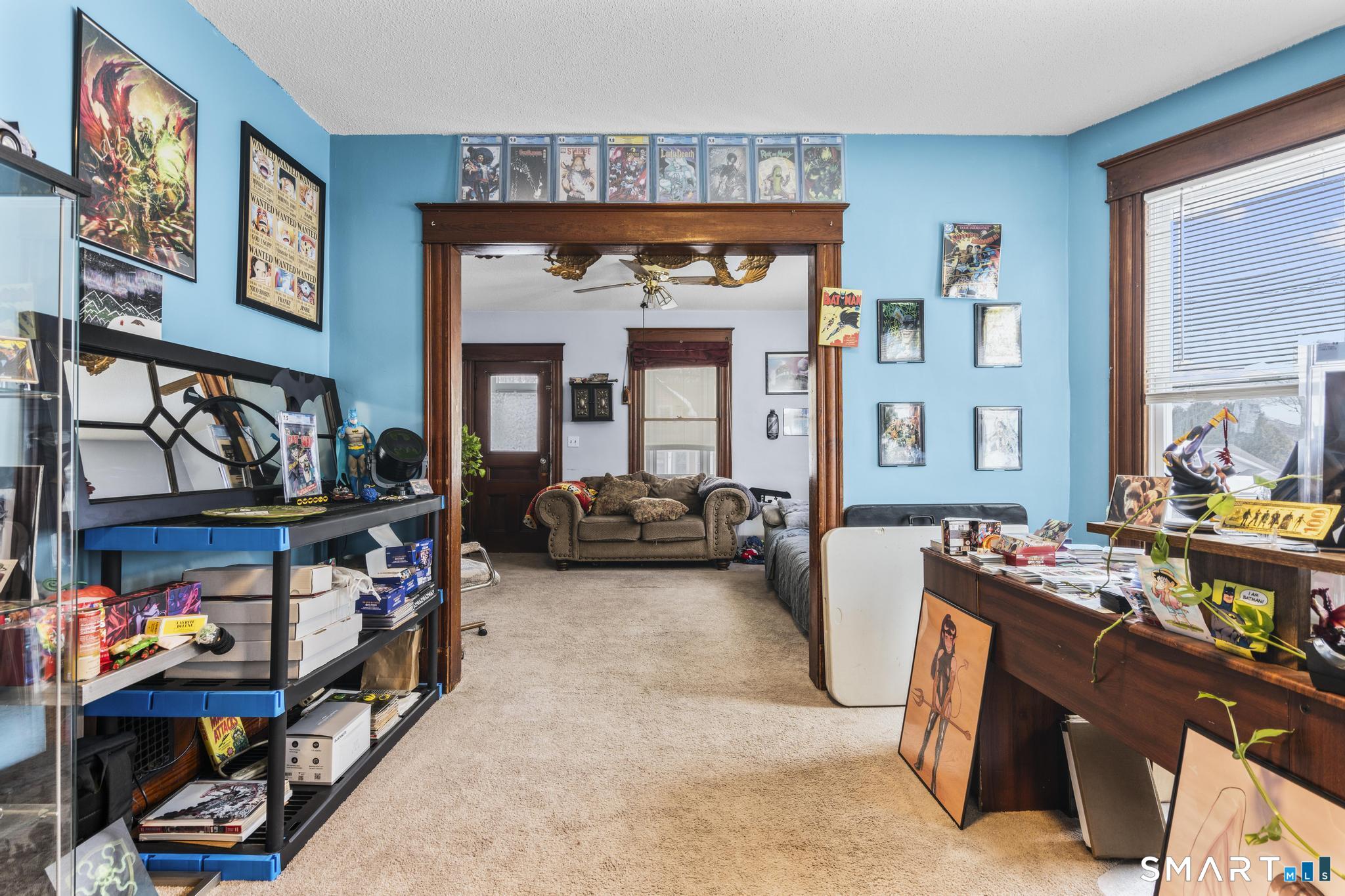 33 Kenney Street Bristol, CT 06010 - Photo 13 of 40 a view of an entryway and livingroom with furniture