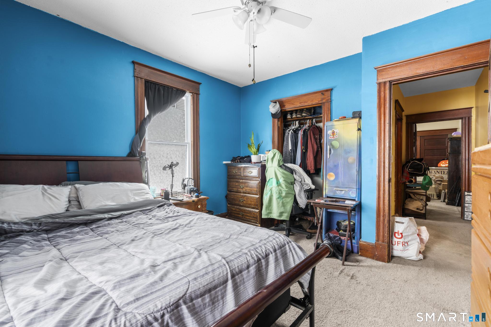 33 Kenney Street Bristol, CT 06010 - Photo 18 of 40 a bedroom with a bed and a mirror