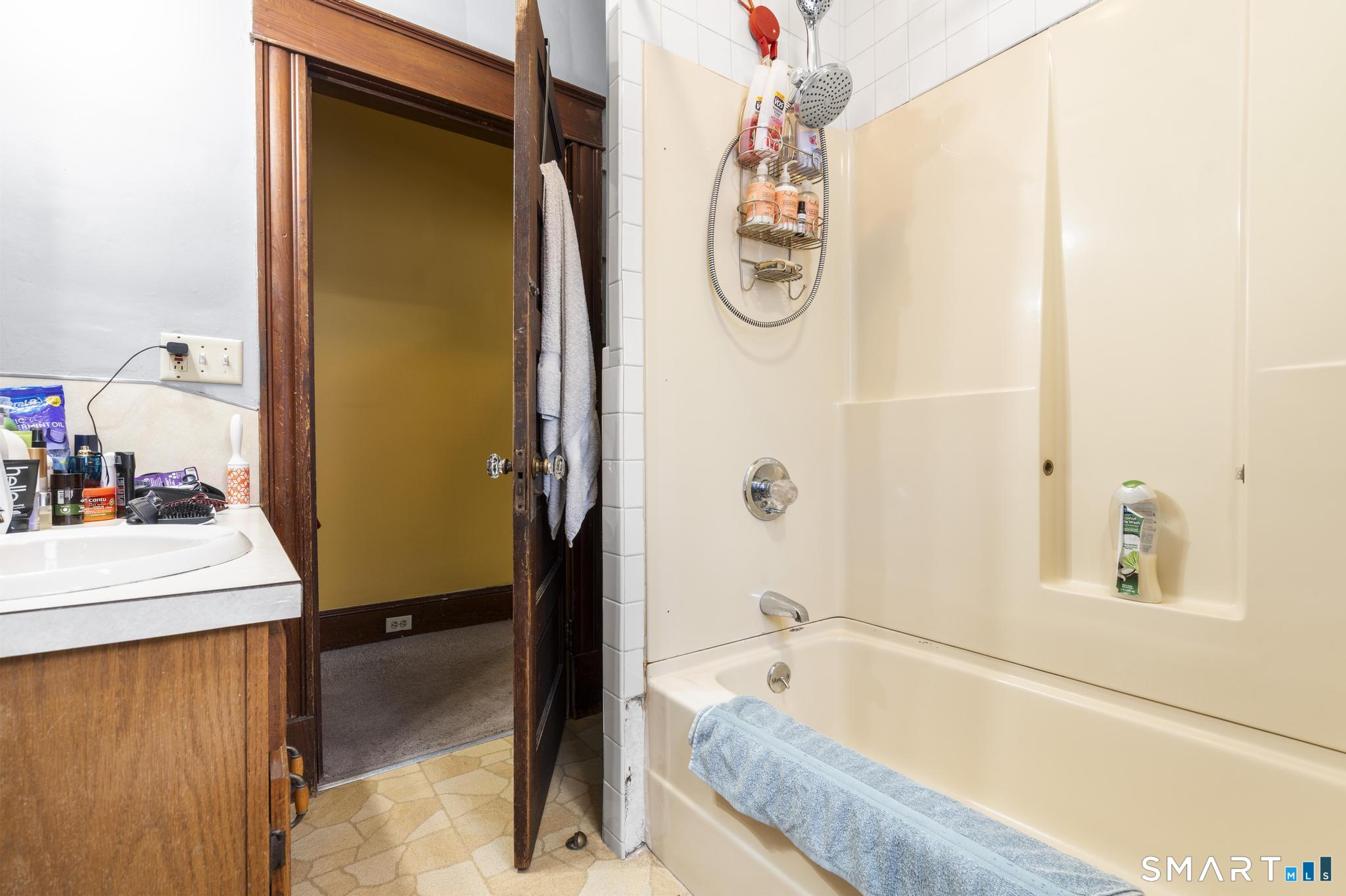 33 Kenney Street Bristol, CT 06010 - Photo 21 of 40 a bathroom with a tub and a sink