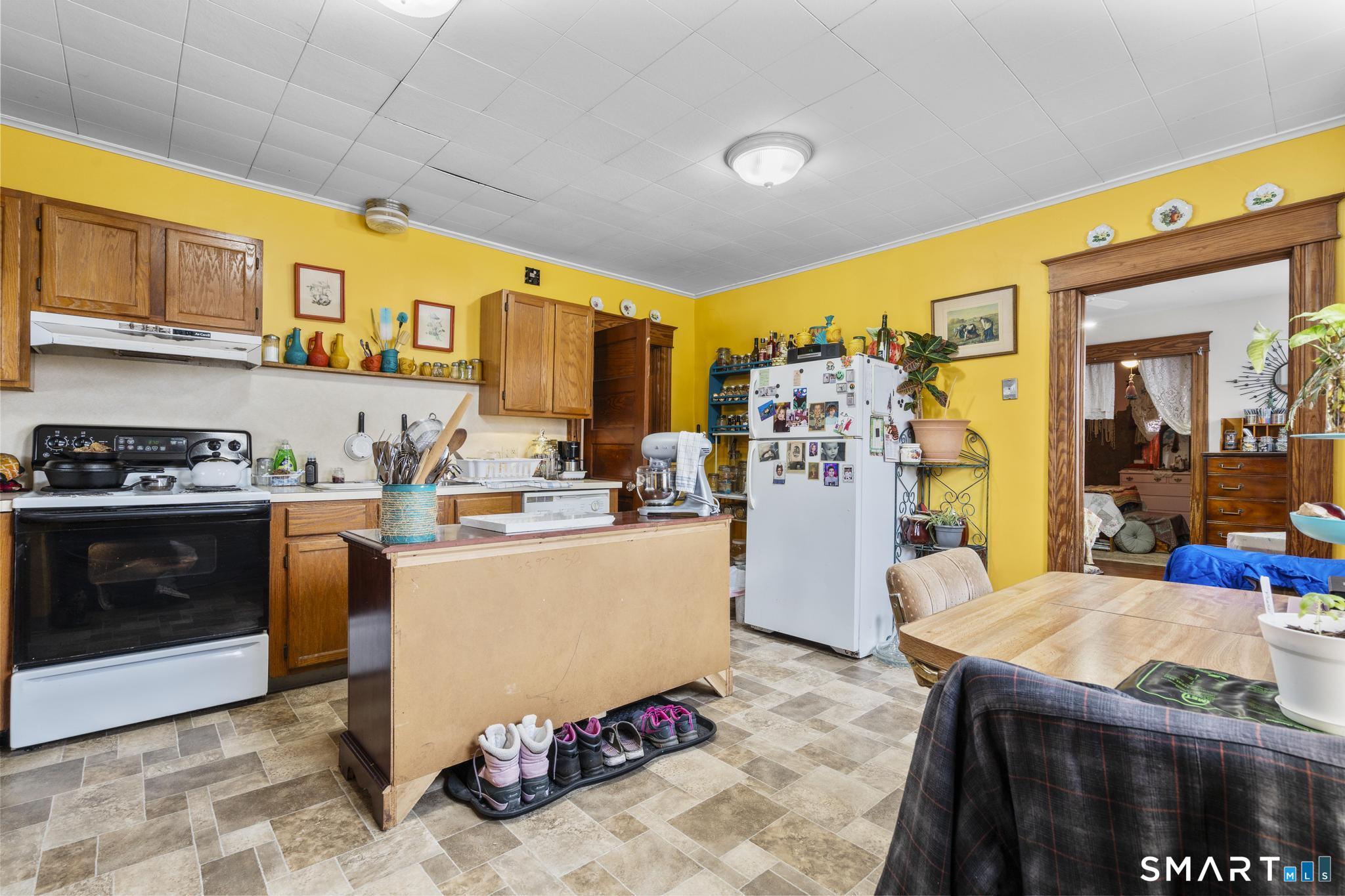 33 Kenney Street Bristol, CT 06010 - Photo 28 of 40 a kitchen with stainless steel appliances granite countertop a stove and a refrigerator