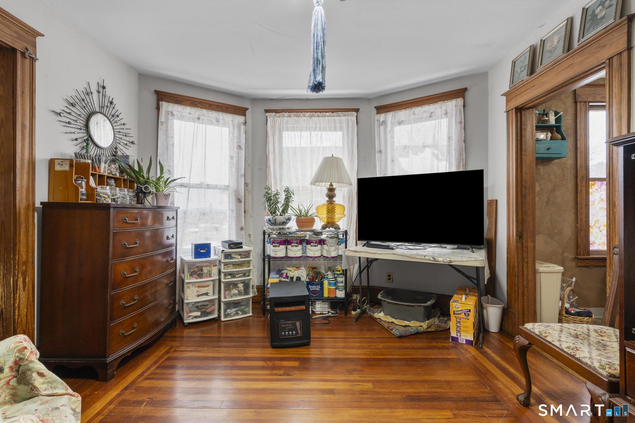 33 Kenney Street Bristol, CT 06010 - Photo 31 of 40 a living room with furniture and a flat screen tv