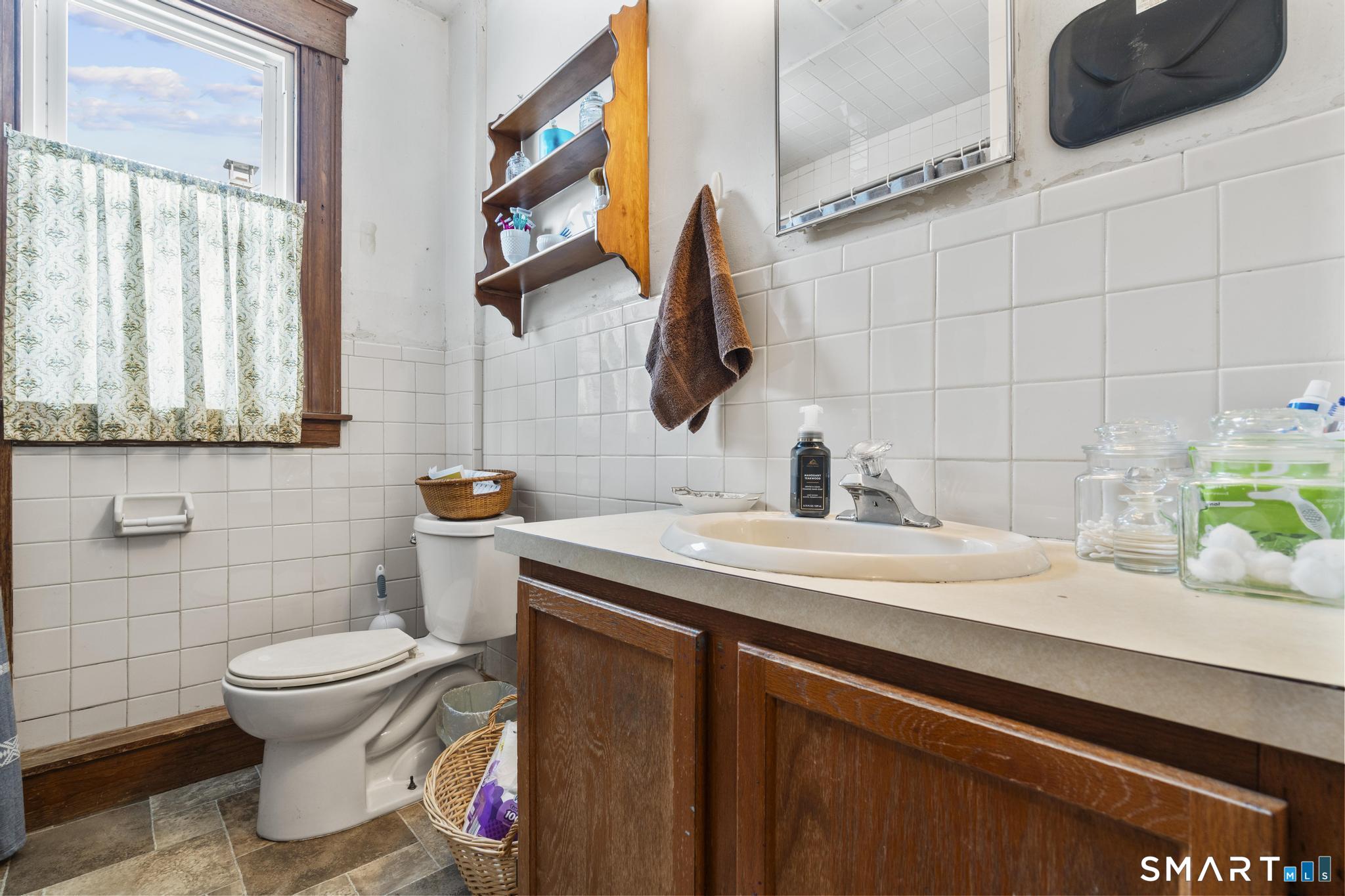 33 Kenney Street Bristol, CT 06010 - Photo 32 of 40 a bathroom with a sink and a toilet
