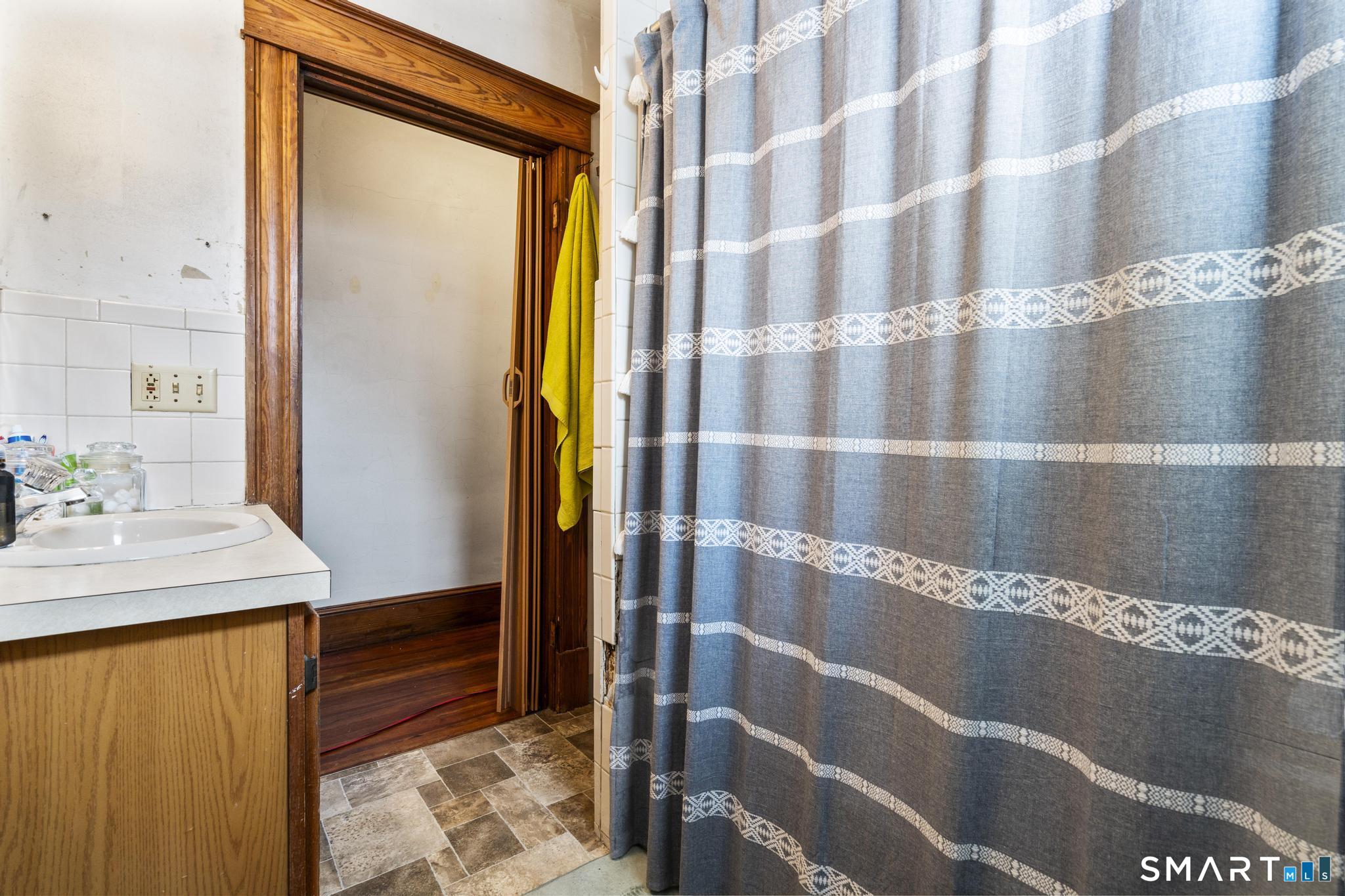 33 Kenney Street Bristol, CT 06010 - Photo 33 of 40 a bathroom with a sink and a mirror