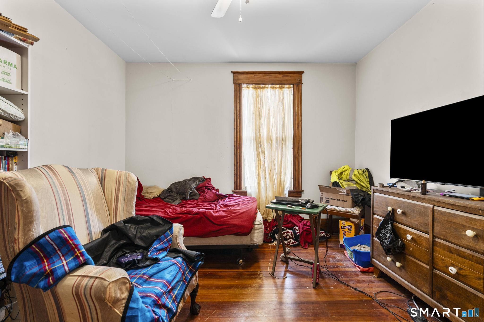 33 Kenney Street Bristol, CT 06010 - Photo 34 of 40 a living room with furniture and a flat screen tv