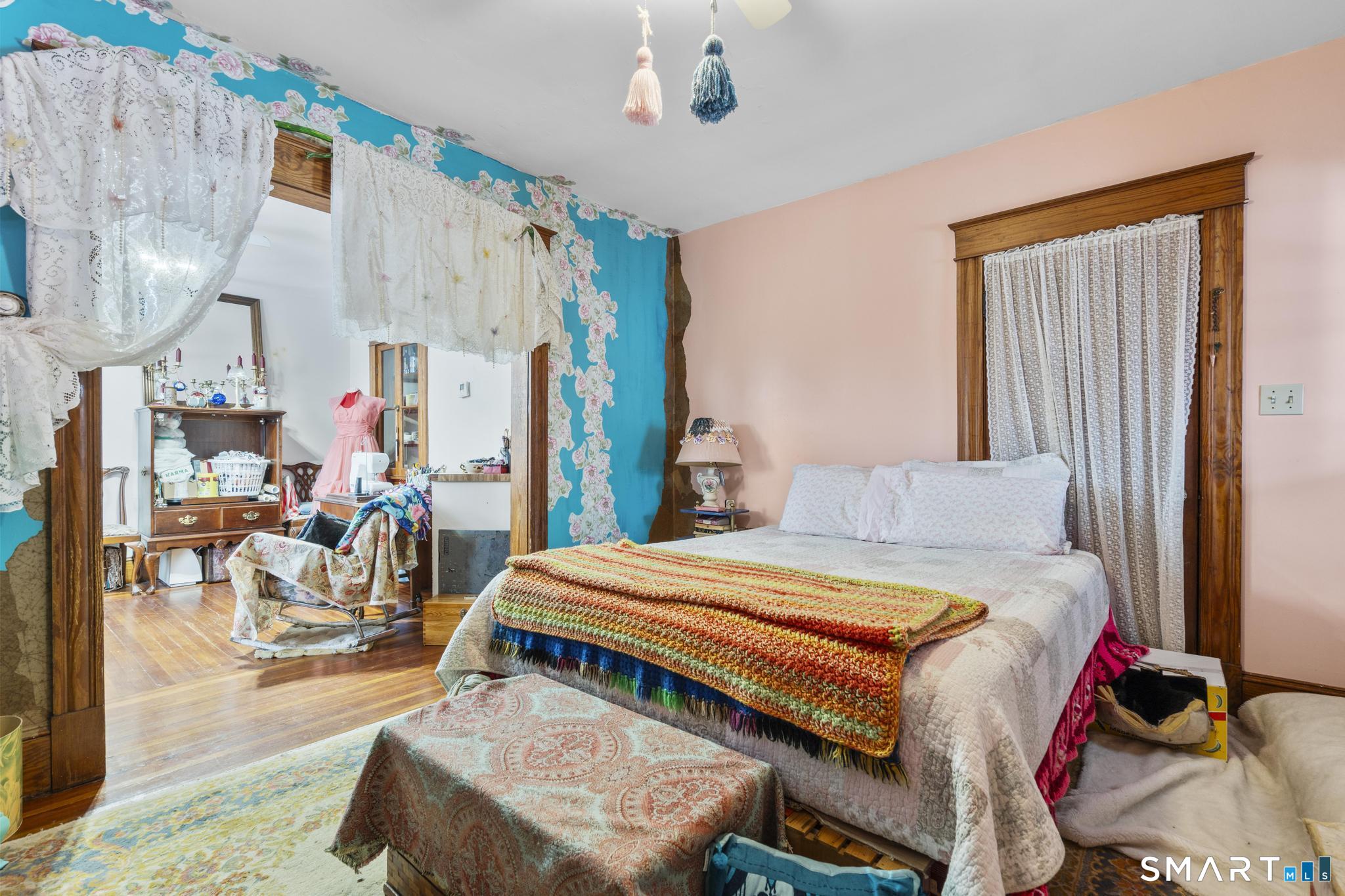 33 Kenney Street Bristol, CT 06010 - Photo 35 of 40 a bedroom with a bed and a chandelier