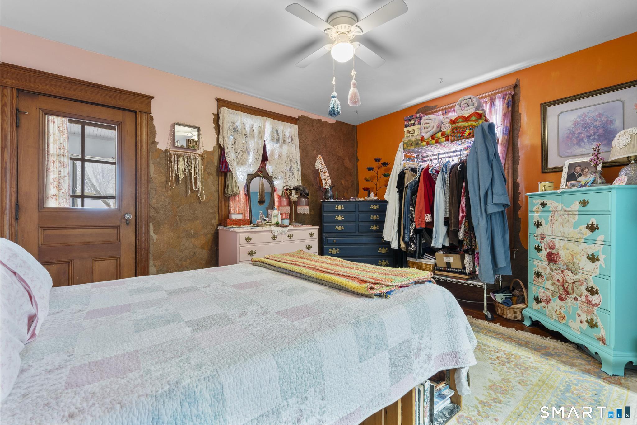 33 Kenney Street Bristol, CT 06010 - Photo 36 of 40 a bedroom with a large bed and a large mirror on the dresser