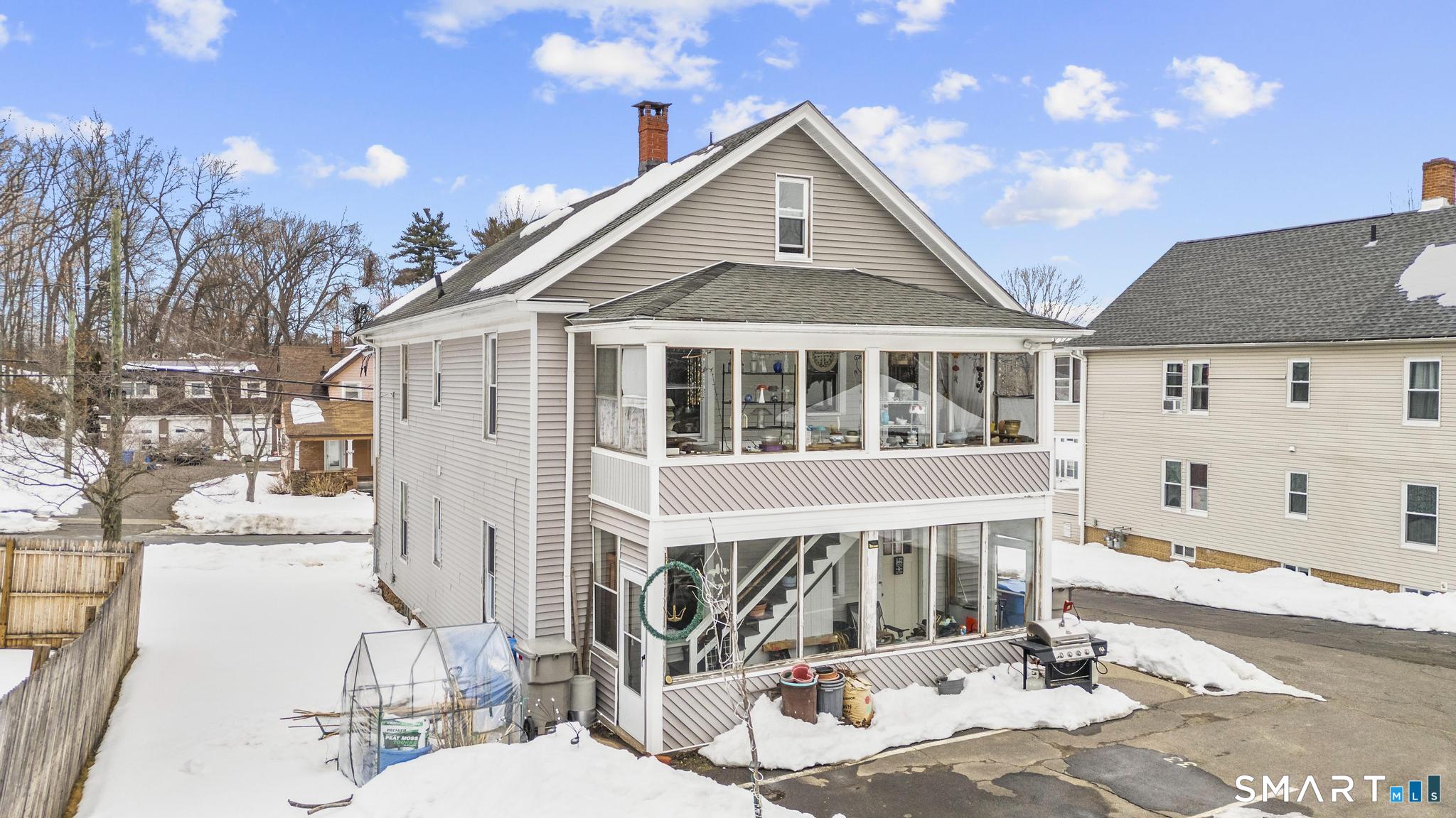 33 Kenney Street Bristol, CT 06010 - Photo 5 of 40 a front view of a house with a yard