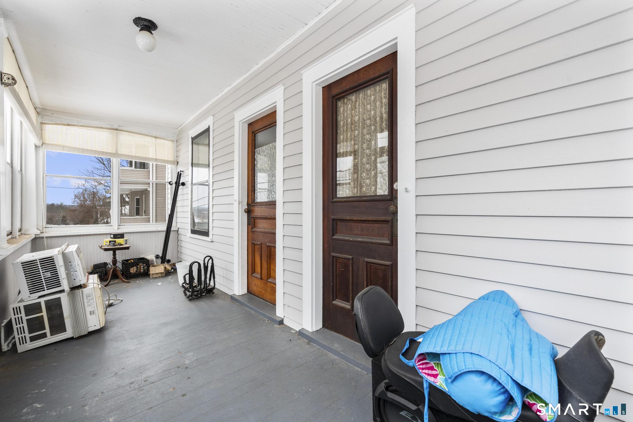 33 Kenney Street Bristol, CT 06010 - Photo 7 of 40 a view of a livingroom with furniture and a floor to ceiling window