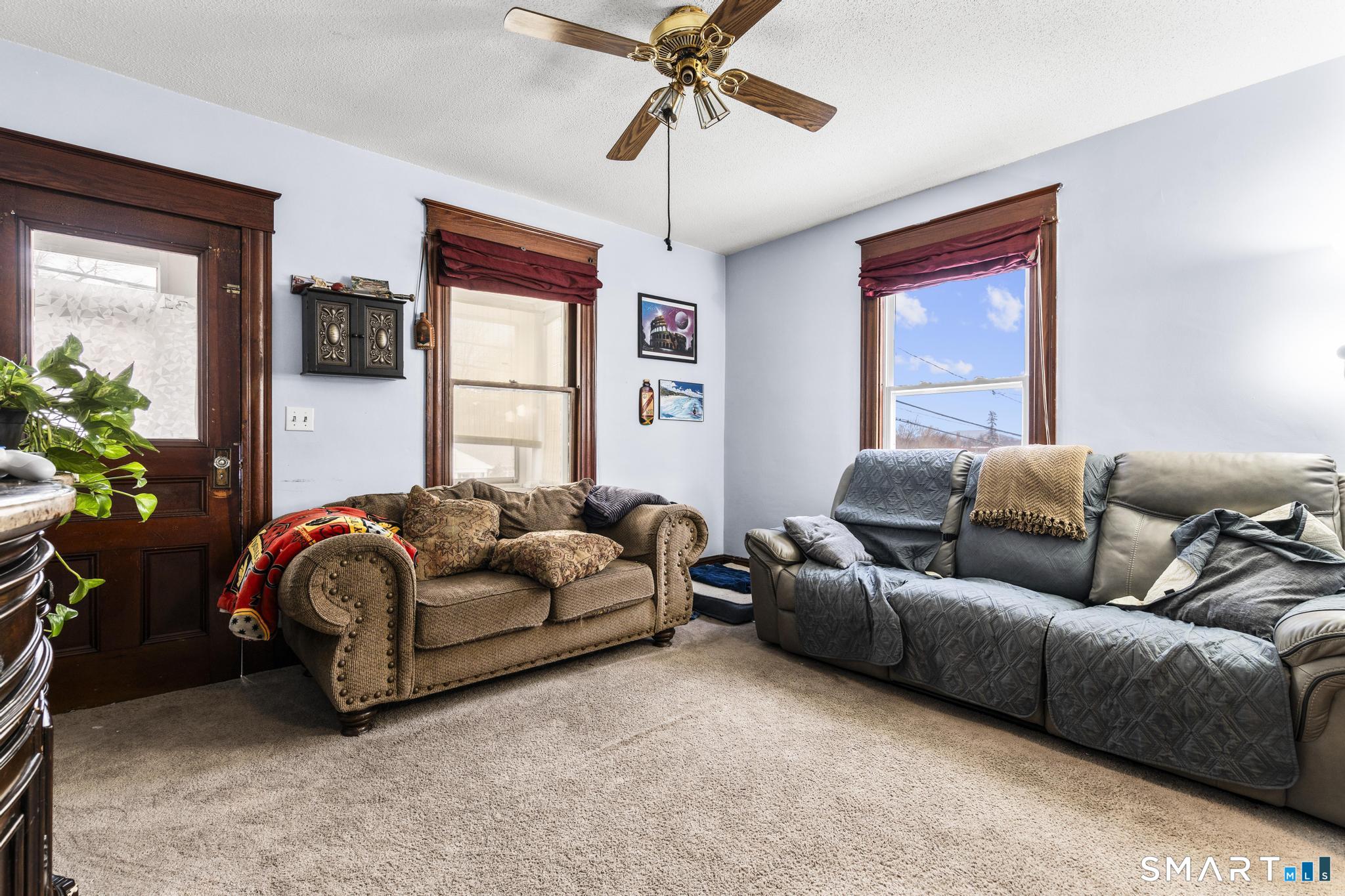 33 Kenney Street Bristol, CT 06010 - Photo 9 of 40 a living room with furniture and a window
