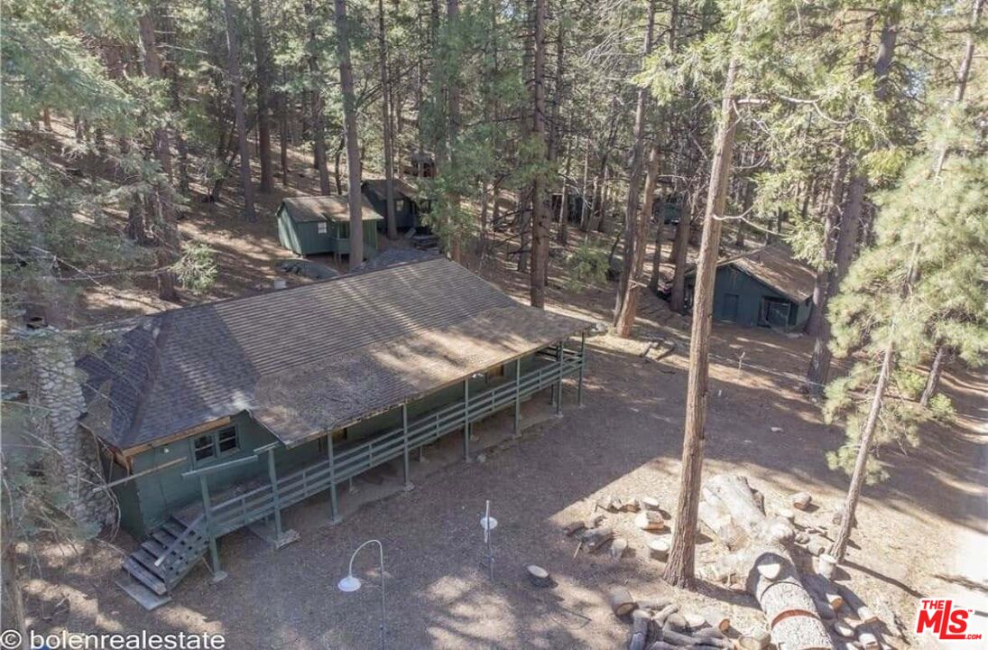 52101 Red Hill Road Idyllwild, CA 92549 - Photo 6 of 8 a view of a backyard with wooden fence and a bench