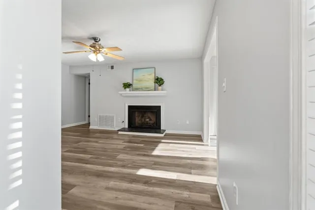 a view of an empty room with a fireplace