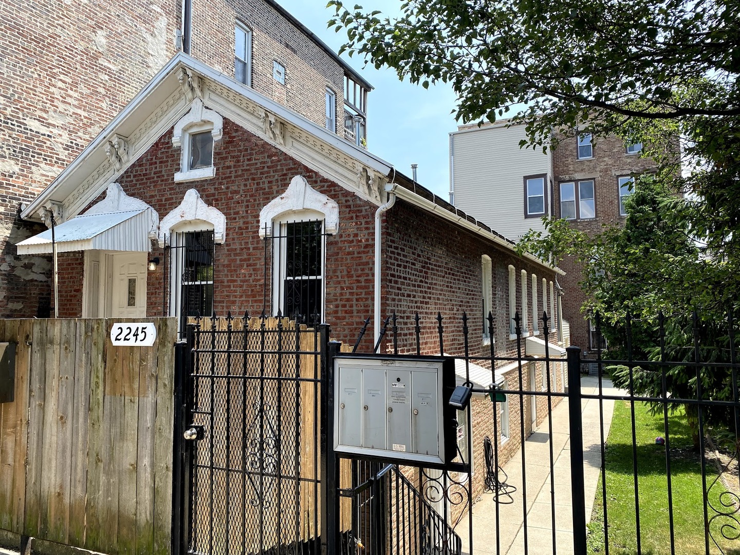 2245 West 21st Street, Unit 4 Chicago, IL 60608 - Photo 1 of 16 a front view of a house with a iron gate
