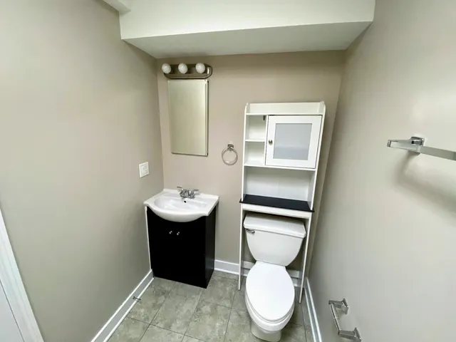 a bathroom with a toilet and a sink