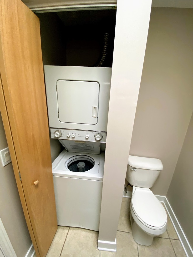 2245 West 21st Street, Unit 4 Chicago, IL 60608 - Photo 15 of 16 a toilet sitting in a bathroom next to a sink