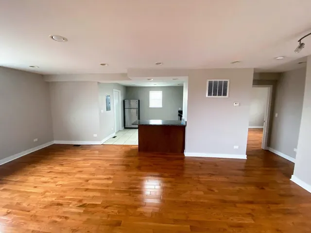 a view of a livingroom with wooden floor
