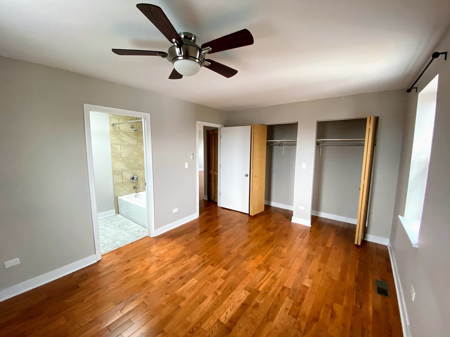 2245 West 21st Street, Unit 4 Chicago, IL 60608 - Photo 9 of 16 a view of an empty room and wooden floor