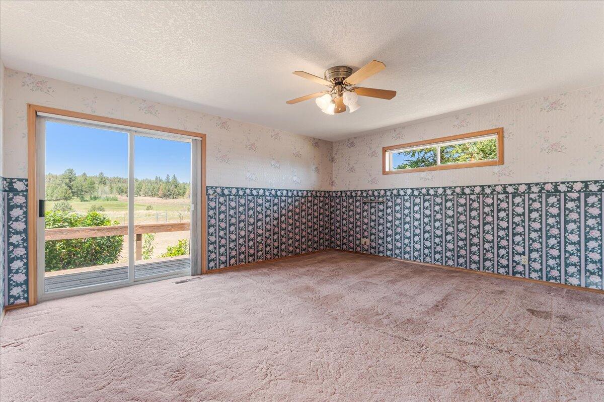 64515 Rock Springs Road Bend, OR 97703 - Photo 26 of 49 Primary Bedroom En Suite with Slider to Deck