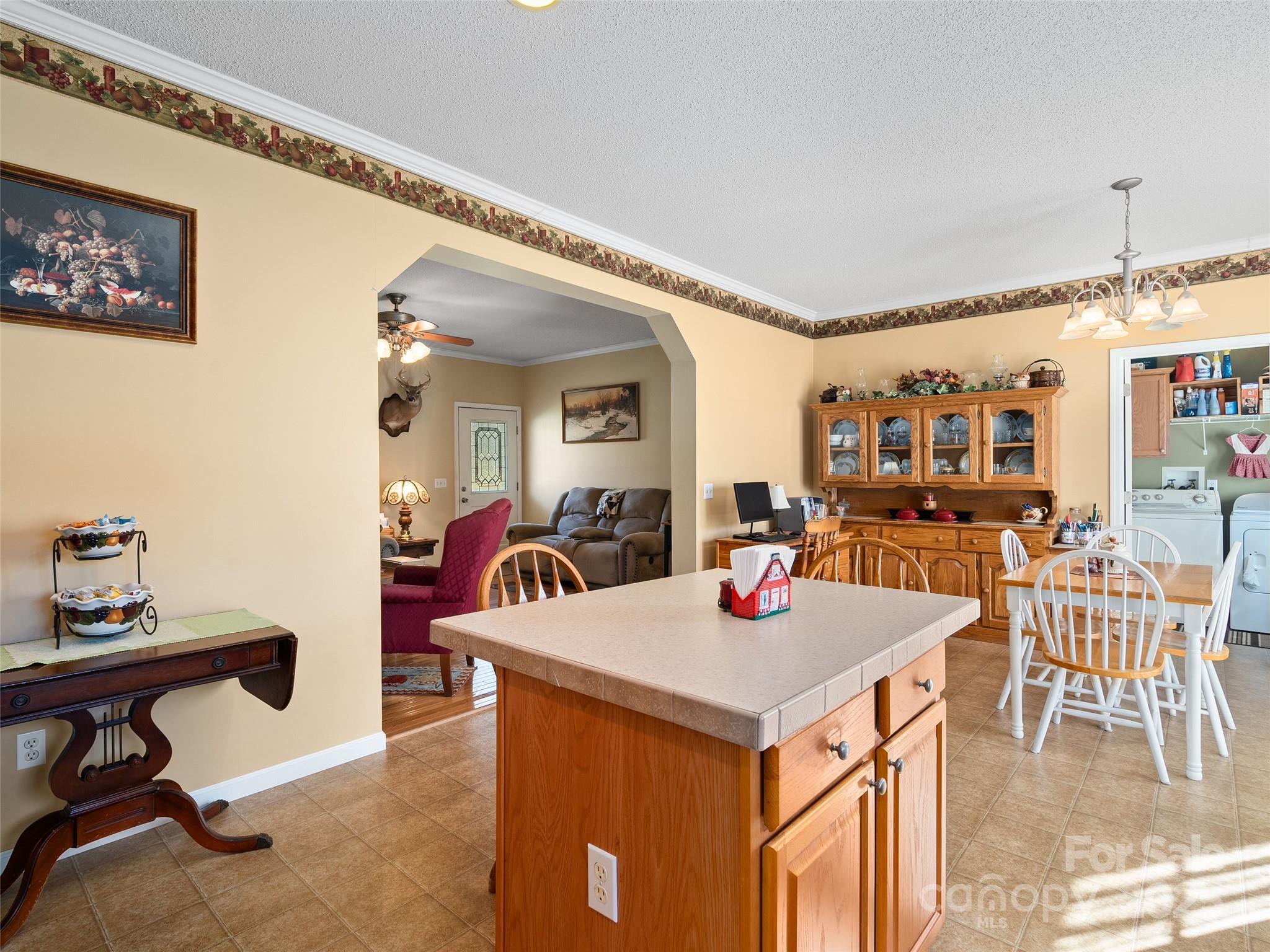 70 Pierce Elders Road Whittier, NC 28789 - Photo 11 of 36 a view of a dining room with furniture and a chandelier