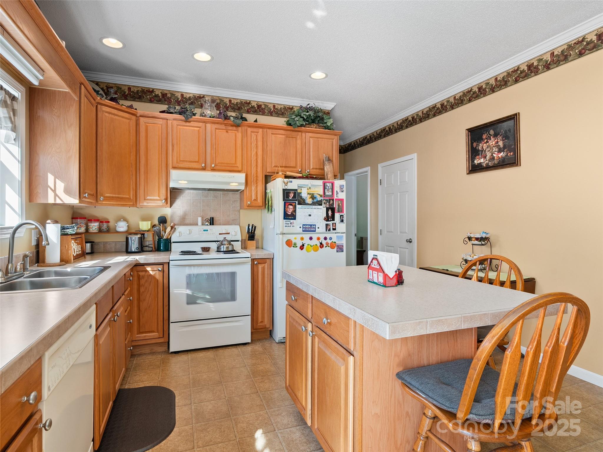 70 Pierce Elders Road Whittier, NC 28789 - Photo 12 of 36 a kitchen with stainless steel appliances granite countertop a stove refrigerator sink and cabinets
