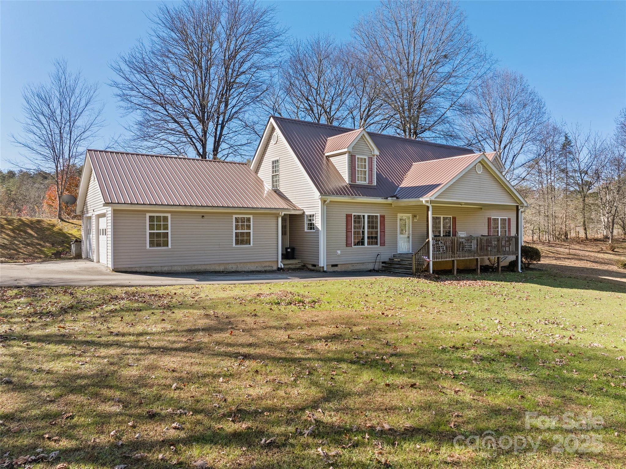 70 Pierce Elders Road Whittier, NC 28789 - Photo 2 of 36 a front view of a house with a garden