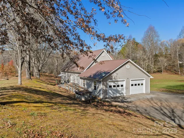 a view of a house with a snow in the background