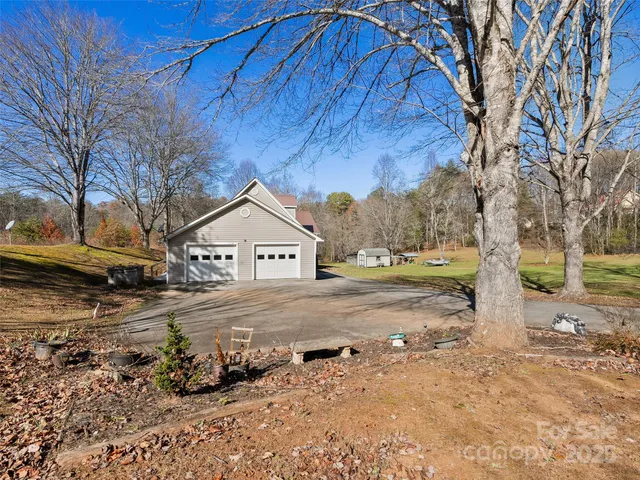 a view of a house with a yard covered in snow