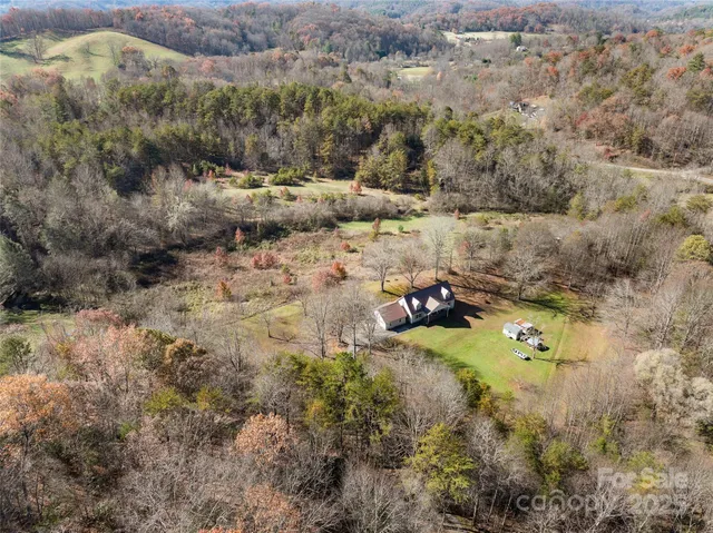 a aerial view of a house with a yard