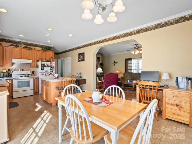 a kitchen that has a table and chairs in it