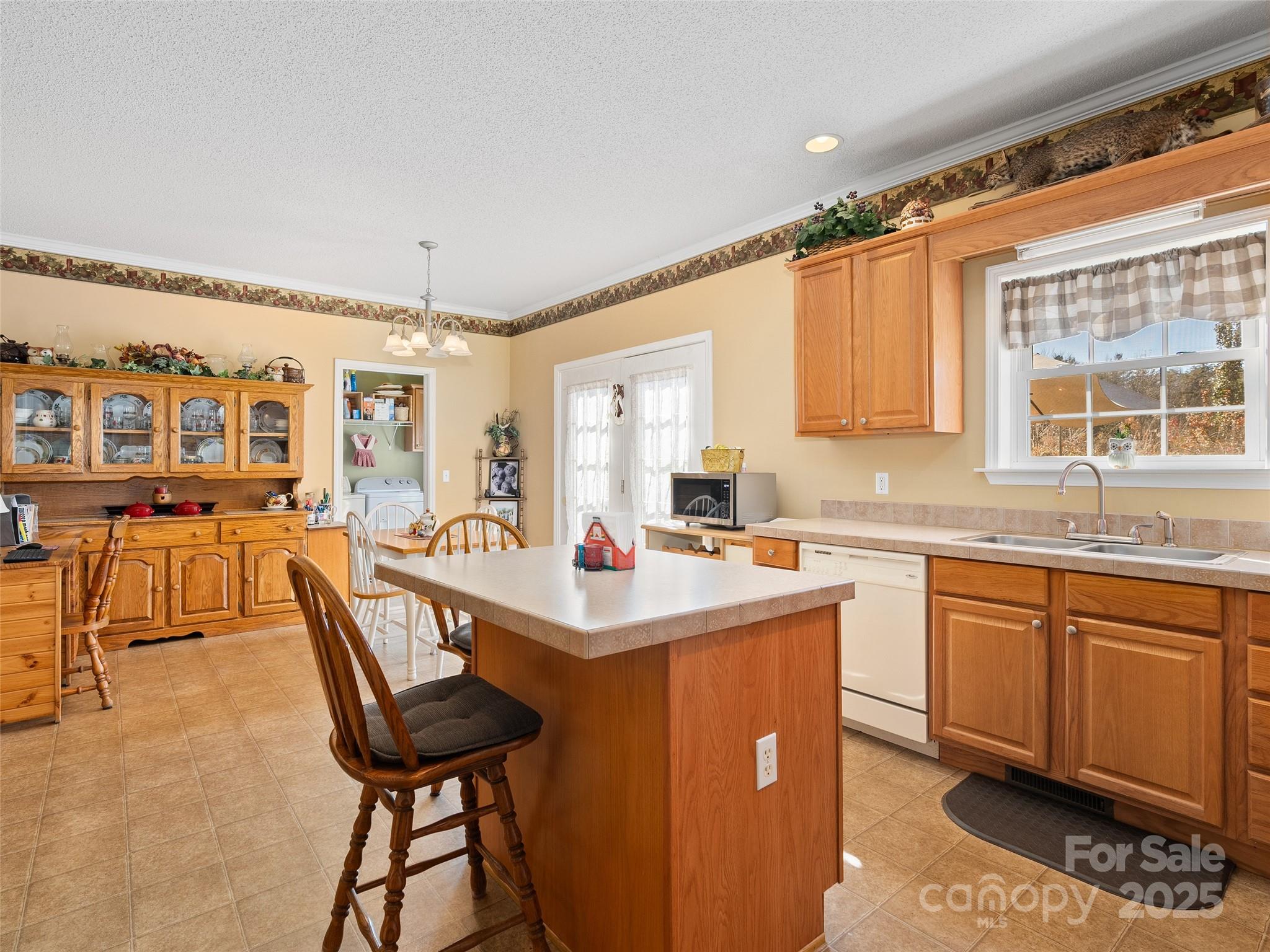 70 Pierce Elders Road Whittier, NC 28789 - Photo 10 of 36 a kitchen that has a lot of cabinets in it and appliances