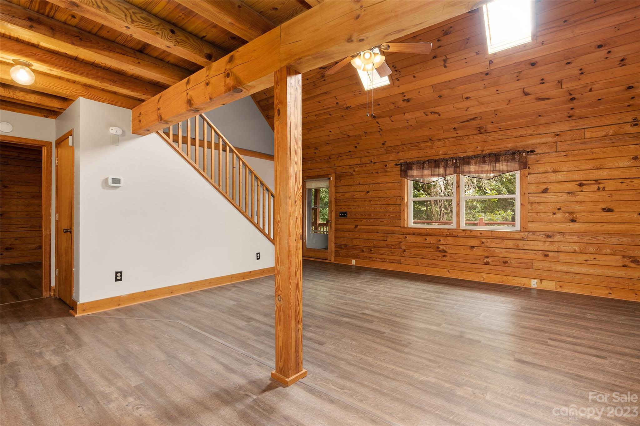 243 Penland Street Clyde, NC 28721 - Photo 8 of 20 a view of an entryway with wooden floor