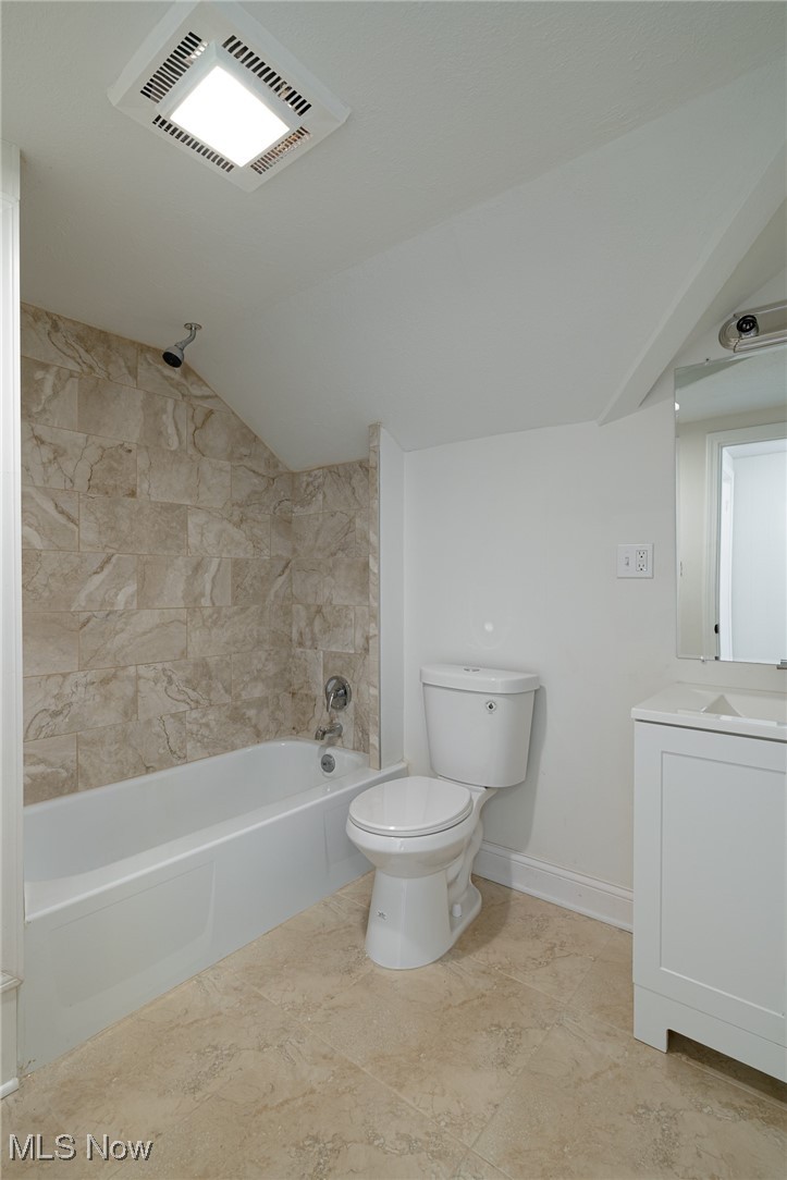 12727 Grannis Road Cleveland, OH 44125 - Photo 32 of 43 Full bathroom with tile patterned floors, toilet, vanity, and tiled shower / bath